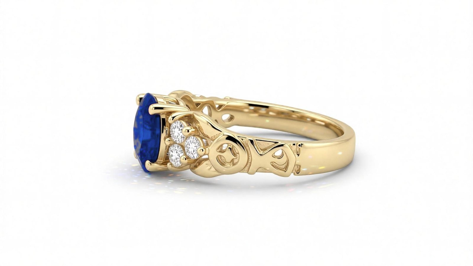Anel Safira Floral — ouro 18k amarelo com safira azul oval e diamantes laterais em galeria gravada com motivos florais